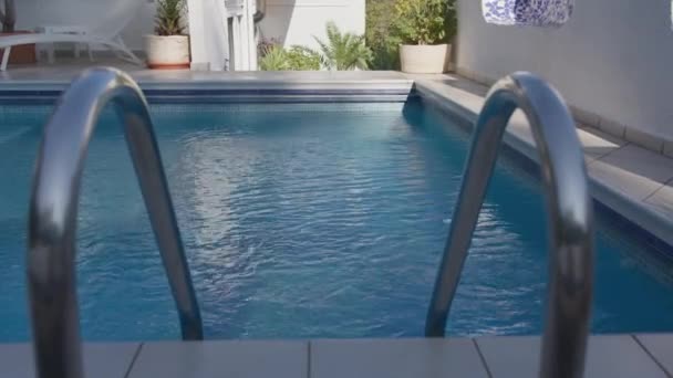 Private Home Swimming Pool Clear Blue Water Metal Ladder Surrounded — Stock Video