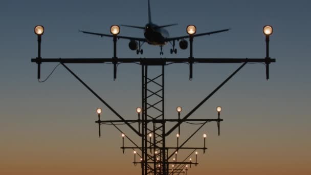 Silhouette Airplane Landing Illuminated Runway Lights Twilight Sky — Stock Video