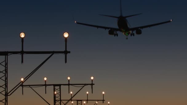 Airplane Landing Configuration Silhouetted Post Sunset Sky Approach Lights Foreground — Stock Video