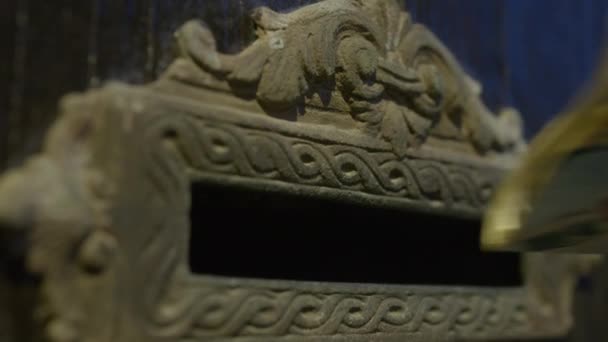 Close Traditional Carved Stone Mailbox Filled Magazines Showcasing Intricate Designs — Stock Video