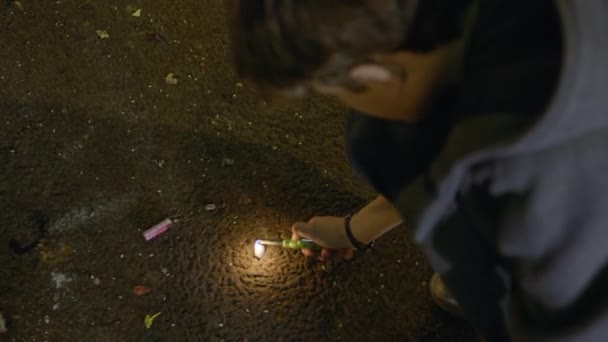 Top View Teenage Boy Lighting Firerecracker Asphalt Street Las Fallas — стоковое видео