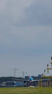 Majestic large passenger airplane soaring into the sky after takeoff from the runway