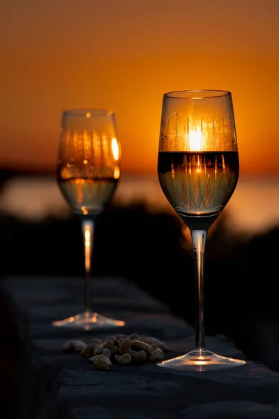 relax time with two glasses of wine at sea sunset