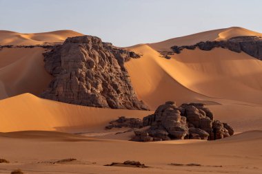 Sahara desert, sand, dunes and rocks in Algeria. Surrounding of Djanet. Place of Sahara named Moul Ennaga clipart