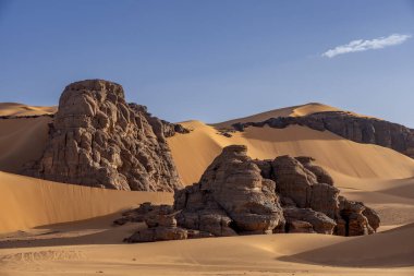 Sahara desert, sand, dunes and rocks in Algeria. Surrounding of Djanet. Place of Sahara named Moul Ennaga clipart