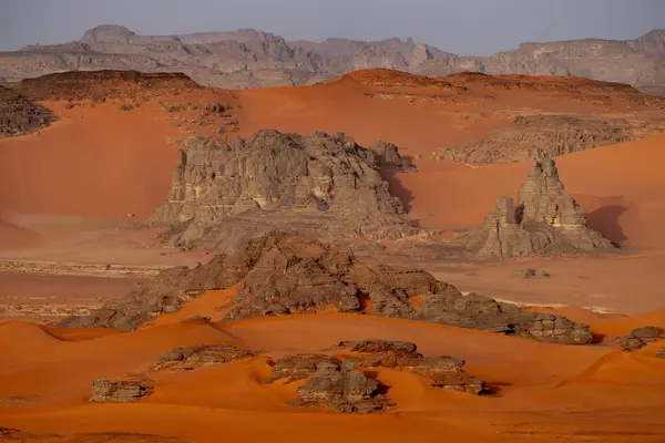 stock image The Tadrart Rouge means Red Mountain. It is a mountain range in southeastern Algeria. The area has a rich array of rock art.