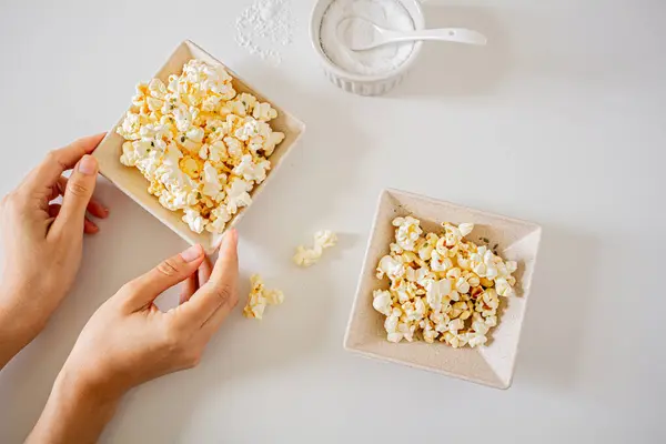 Top View Female Hands Holding Plate Full Popcorn — Stock Photo, Image