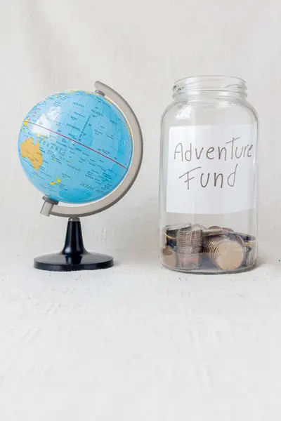 Glass Jar Message Adventure Fund Some Coins Next Earth Globe — Stock Photo, Image