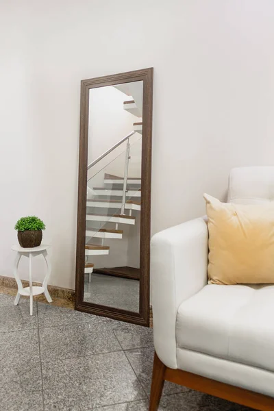 Stairs reflection in the mirror. Home decor concept.