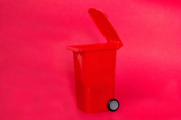 Trash can on red background. Recycle concept.