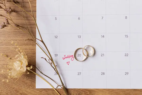 Wedding Preparations Flat Lay - Bridal Planner and Golden Wedding Rings