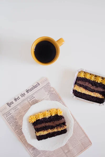 delicious chocolate cake with mug of coffee. Party comfort food concept.
