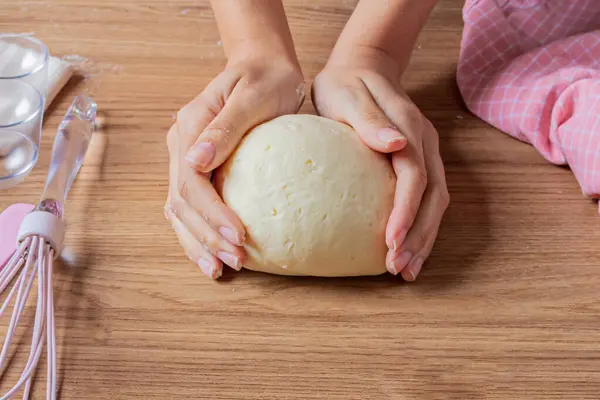 Young Woman Baking Cheese Bread - Homemade Brazilian Recipe for Breakfast