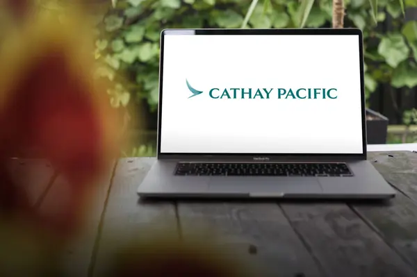 stock image WROCLAW, POLAND - NOVEMBER 29, 2023:Cathay Pacific logo (CPA), largest carrier of Hong Kong, China, headquartered at Hong Kong International Airport., displayed on MacBook Pro screen