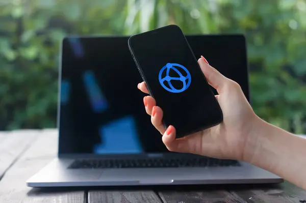 stock image WROCLAW, POLAND - JULY 2, 2024:Atlas logo, a tool by Atlassian that connects teams and projects, offering status updates, goal tracking, and progress visibility, displayed on iPhone screen