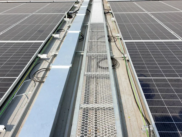 Solar rooftop walkway installation on the factory roof.