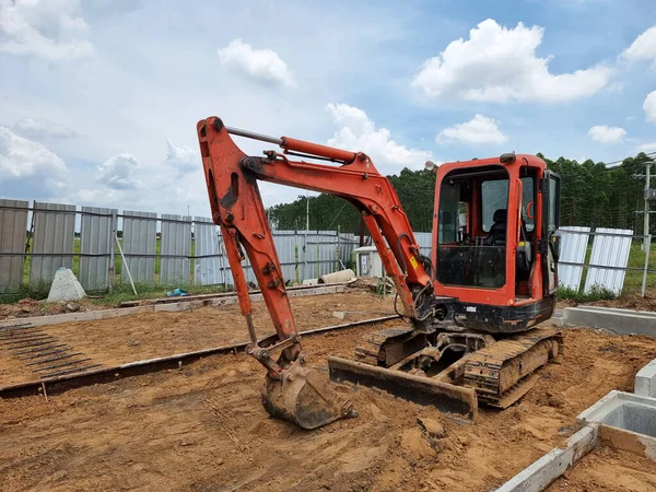 Mini Hydraulic Excavator or diggers prepare the road area in the substation construction