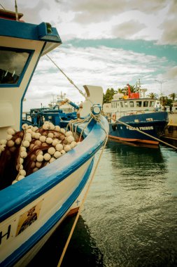 view of Fishing boats in the harbor of Kavala city in Greece. Dock for boats and yachts. clipart