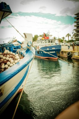 view of Fishing boats in the harbor of Kavala city in Greece. Dock for boats and yachts. clipart