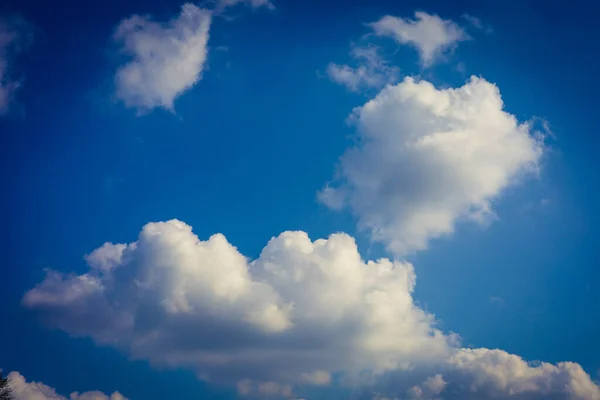 Cloudy blue sky background, horizontal picture. Beautiful blue sky with tiny and soft fluffy clouds after raining. Elegant cloudy blue sky wallpaper background. Landscape image. Texture background.