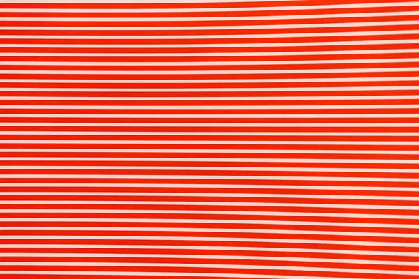white horizontal stripes on red paper background holiday pattern