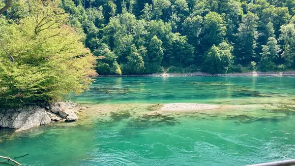 the turquoise coloured water at the Rheinfall in Schaffhausen, Switzerland