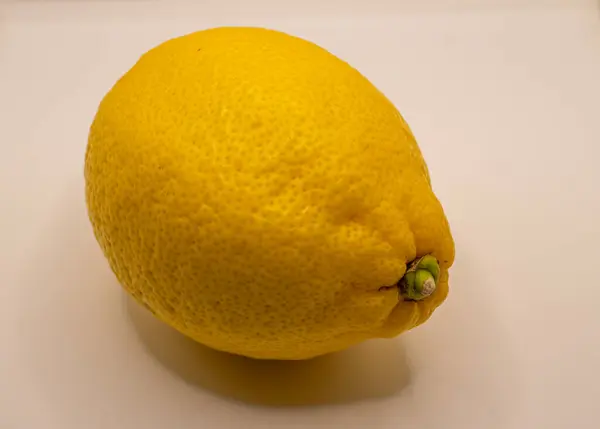 yellow lemon on white background close view