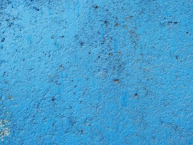 Arkaplan kullanımı için desenli eski bir grunge ile parlak mavi renkli duvar 
