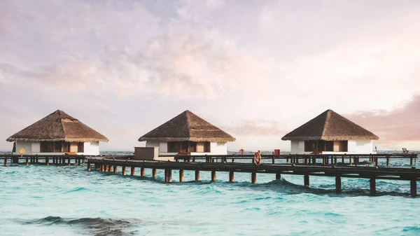Wide Angle Shot Group Three Overwater Bungalows Thatched Roofs Connected — Φωτογραφία Αρχείου