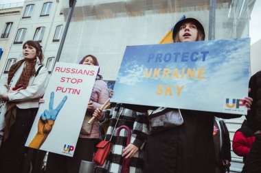 Lisbon, Portugal - February 24, 2023: People united together to protest, holding peaceful anti-war messages on banners marking the one-year anniversary of the war in Ukraine