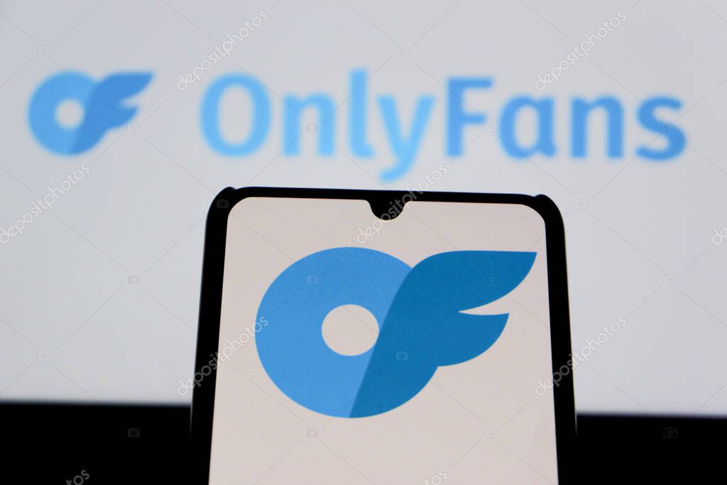 Bandung, Indonesia - August 12, 2025: In this photo illustration, The OnlyFans logo displays on a mobile phone with OnlyFans logo in the background.