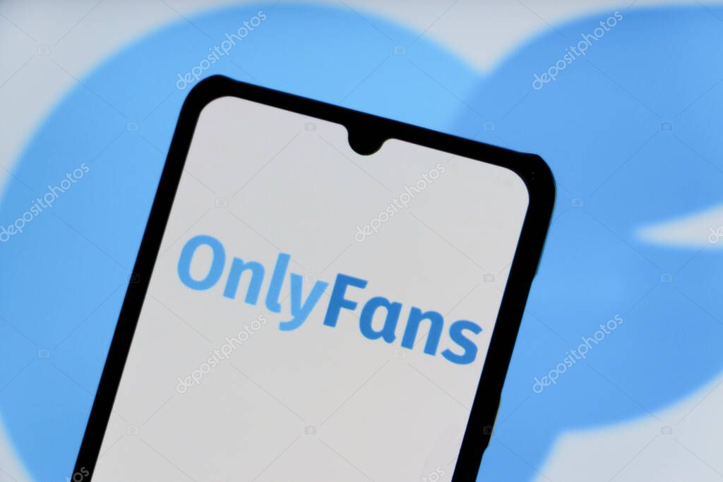 Bandung, Indonesia - August 12, 2025: In this photo illustration, The OnlyFans logo displays on a mobile phone with OnlyFans logo in the background.