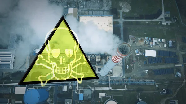 Industrial smoke emission from chimney with danger sign indicating health hazard. Aerial top down