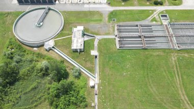Aerial view of water cleaner plant purification system with big steel tank and pipeline for drinkable water supply