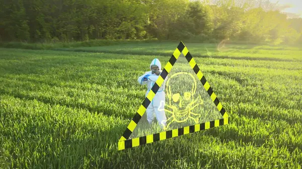 Scientist in protective suit analyzes nature in front of digital skull warning symbol, concept virus spread, contamination, poor soil conditions