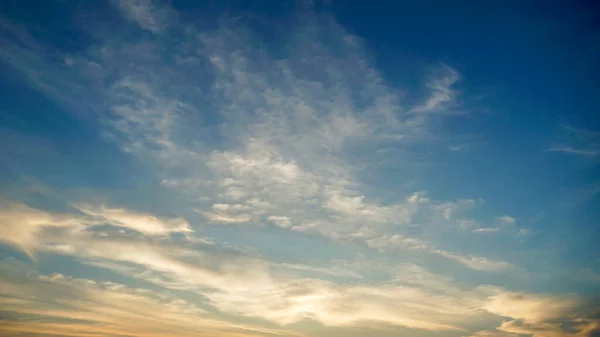 Real amazing panoramic sunrise or sunset sky with gentle colorful clouds. Gradient sky texture after sunset. Pastel Gentle colors of Sunset Sunrise Sundown Sky with colorful clouds. sunset in the clouds
