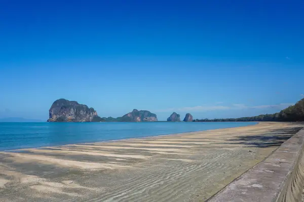 stock image view panorama evening soft focus sand beach with blurred island and orange sky background, sunset at Chao Mai Beach, Had Chao Mai National Park, Trang Province, southern of Thailand.