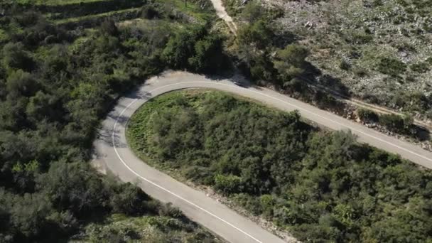 Speeding through the mountains.Thrilling drone footage of a motorcyclist on the Vall d'Ebo Pass.Motorcycle trip in Spain.
