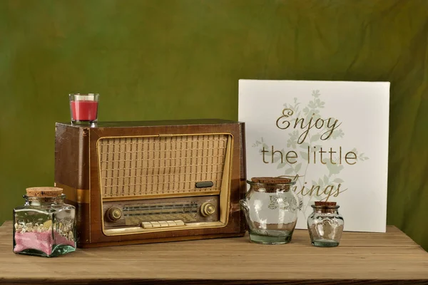 old radio with decorative objects on a table and space for advertising