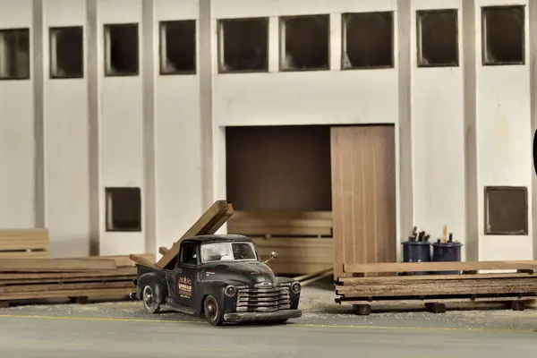 toy car and truck mockup with an industrial building