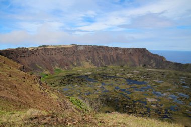 View into the volcano caldera of Rano Kao, an extinct shield volcano in the southwest of Easter Island- Rapa Nui, Chile, South America clipart