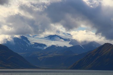 Makushin Volcano is a 2,036 meter high volcano, which is located on Unalaska Island in the Aleutian Islands in the US state of Alaska clipart