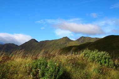 Landscape of Unalaska Island an island in the Fox Islands in the west-eastern center of the Aleutian Islands clipart