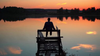 Man is having a rest near the lake