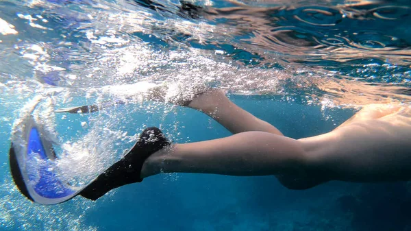 Fin swimming, underwater shot, close up