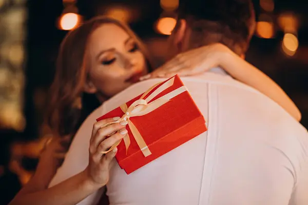 Woman holding a present for her boyfriend on valentines day