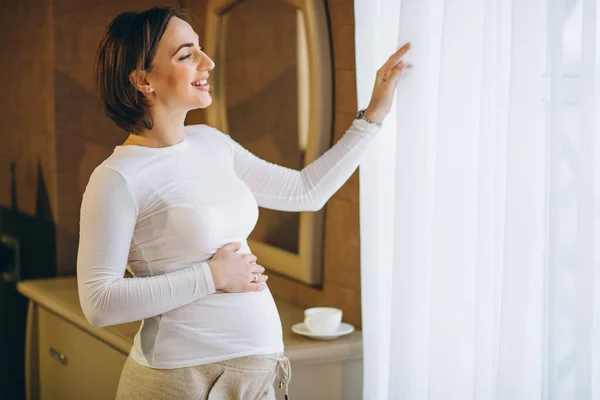 Young Pregnant Woman Standing Window Drinkig Coffee — Stock Photo, Image