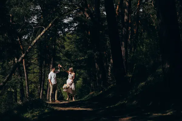 Young couple having a walk in the woods