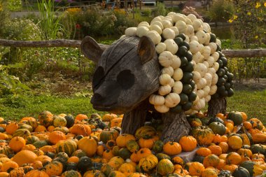 LUDWIGSBURG, GERMANY , 30  AUGUST 2022.  Figures made from a pumpkin in the park of the town of Ludwigsburg, Germany. clipart