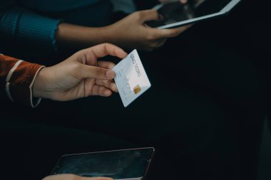 Close up of woman hand using credit card and laptop for payment and online shopping, Online shopping, payments digital banking, E-commerce concept.